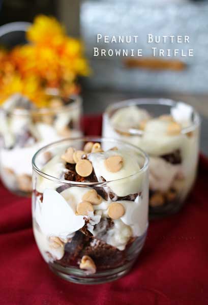 Brownie chunks layered with simple frosting & sprinkled with peanut butter chips makes these Peanut Butter Brownie Trifles a delicious chocolate & peanut butter dessert.