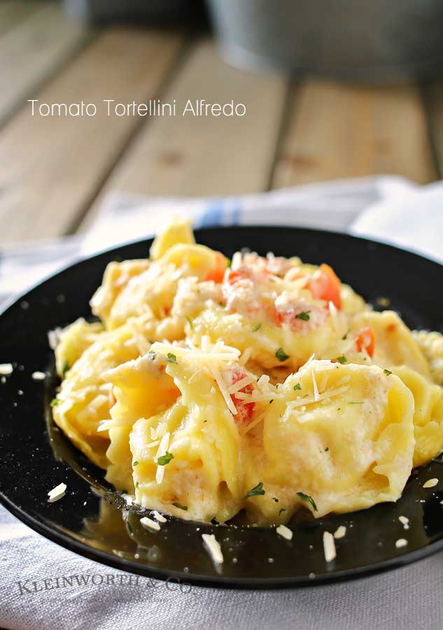 Need an easy family dinner idea that preps in about 20 minutes. Tomato Tortellini Alfredo is tortellini, tomatoes & homemade Alfredo sauce that's amazing! You won't believe how easy this is!