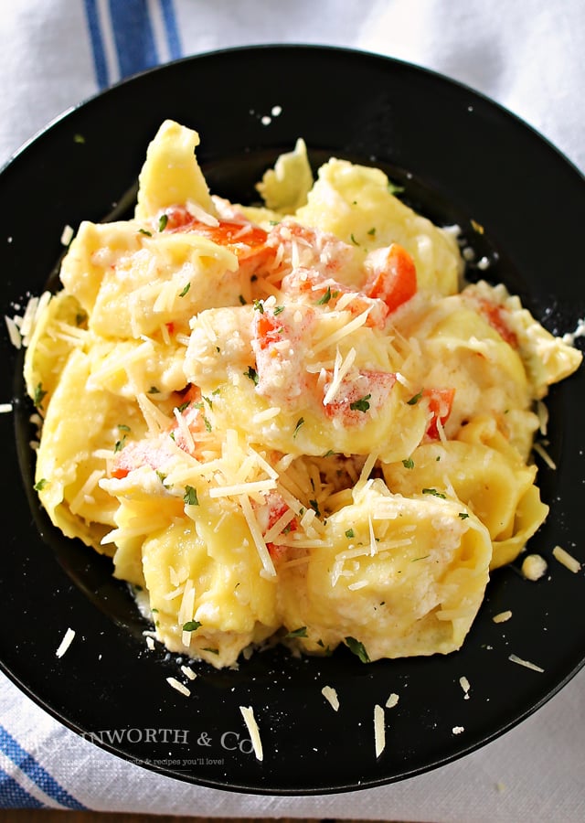 Need an easy family dinner idea that preps in about 20 minutes. Tomato Tortellini Alfredo is tortellini, tomatoes & homemade Alfredo sauce that's amazing! You won't believe how easy this is!