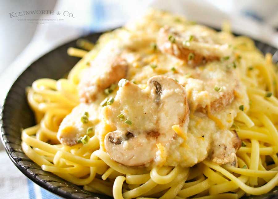 Easy family dinner ideas got better with creamy cauliflower & leek sauce, buttery garlic mushrooms & cheddar cheese on linguine to make Cheddar Mushroom Linguine.