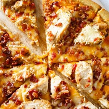 Grilled Chicken & Bacon Pizza with Garlic Cream Sauce is the best homemade pizza recipe EVER! Better than any frozen, take & bake or delivery. WOW! AMAZING! Don't miss my tip for quick & easy prep time too!