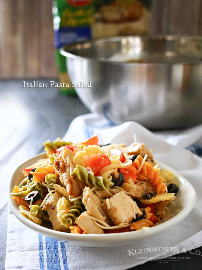 Italian Pasta Salad is an easy side dish that includes grilled & ready chicken, tomatoes, olives and Italian dressing. Simple to make in under 20 minutes.