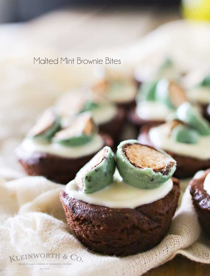 Mint & chocolate lovers rejoice. If you crave that delectable mint & chocolate combo, then this is your lucky day. Thick & fudgy brownie bites topped with white chocolate & mint malt balls makes these Malted Mint Brownie Bites that are out of this world fantastic. YUM! Plus don't miss my trick for making these in under 15 minutes.