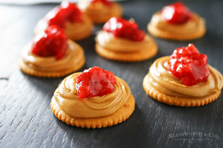 Creamy peanut butter, sweet strawberry jelly & Ritz crackers make Peanut Butter Jelly Bites that are an easy to make snack or appetizer. Salty sweet YUM!