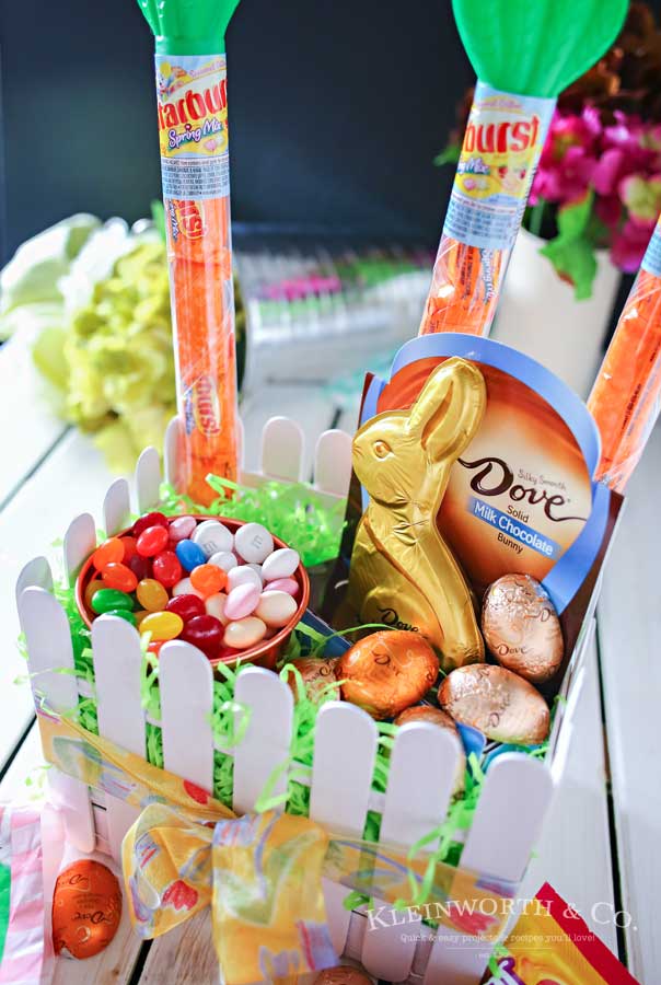 This adorable Picket Fence Easter Basket is easy to make with this step-by-step tutorial using tongue depressors or popsicle sticks. Load it full of your favorite Easter candy & you know everyone will love it. It's definitely my favorite Easter craft! Makes for a great display in an entryway for all your Easter party guests or even to decorate at your office. You won't believe just how quickly you can make your own!