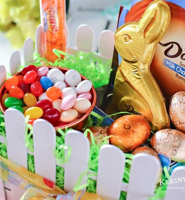 This adorable Picket Fence Easter Basket is easy to make with this step-by-step tutorial using tongue depressors or popsicle sticks. Load it full of your favorite Easter candy & you know everyone will love it. It's definitely my favorite Easter craft! Makes for a great display in an entryway for all your Easter party guests or even to decorate at your office. You won't believe just how quickly you can make your own!