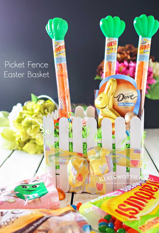 This adorable Picket Fence Easter Basket is easy to make with this step-by-step tutorial using tongue depressors or popsicle sticks. Load it full of your favorite Easter candy & you know everyone will love it. It's definitely my favorite Easter craft! Makes for a great display in an entryway for all your Easter party guests or even to decorate at your office. You won't believe just how quickly you can make your own!