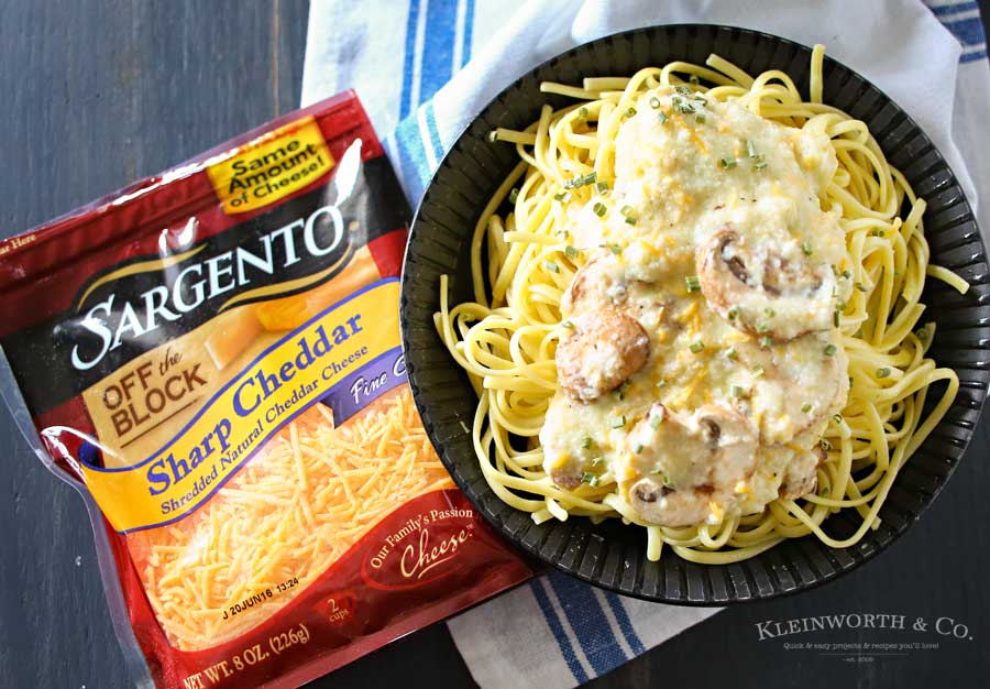 Easy family dinner ideas got better with creamy cauliflower & leek sauce, buttery garlic mushrooms & cheddar cheese on linguine to make Cheddar Mushroom Linguine.