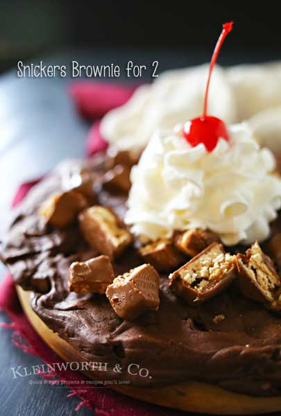 Snickers Brownie for 2, the perfect Valentine's Day treat. Thin brownie layer loaded with Snickers bar pieces & topped with whipped cream and cherry! YUM!