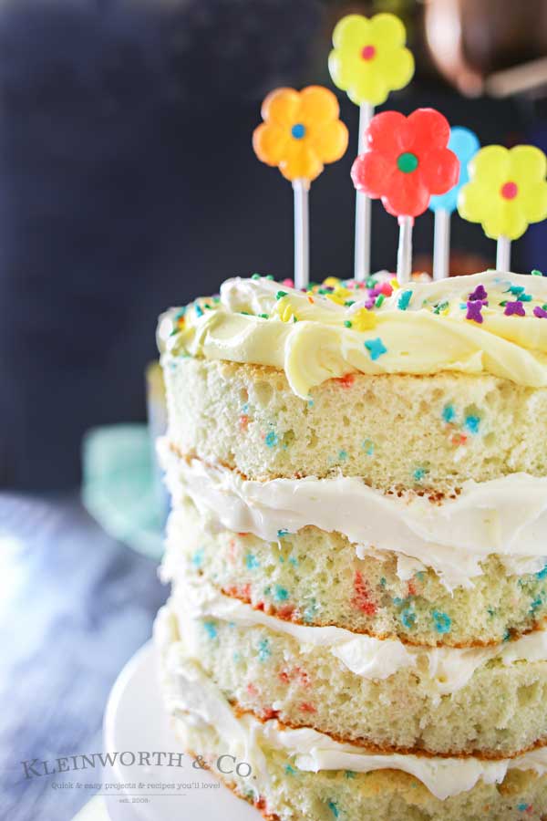 Spring celebrations are fun & easy with this Spring Funfetti® Cake. You can create fun family moments with this cake recipe as one of your Easter desserts. Using frosting just in-between layers for that "naked cake" look that is SO popular right now. It's gives the perfect amount of cake to frosting ratio & it's absolutely delicious! I'm loving it for all our holiday & spring birthday celebrations.