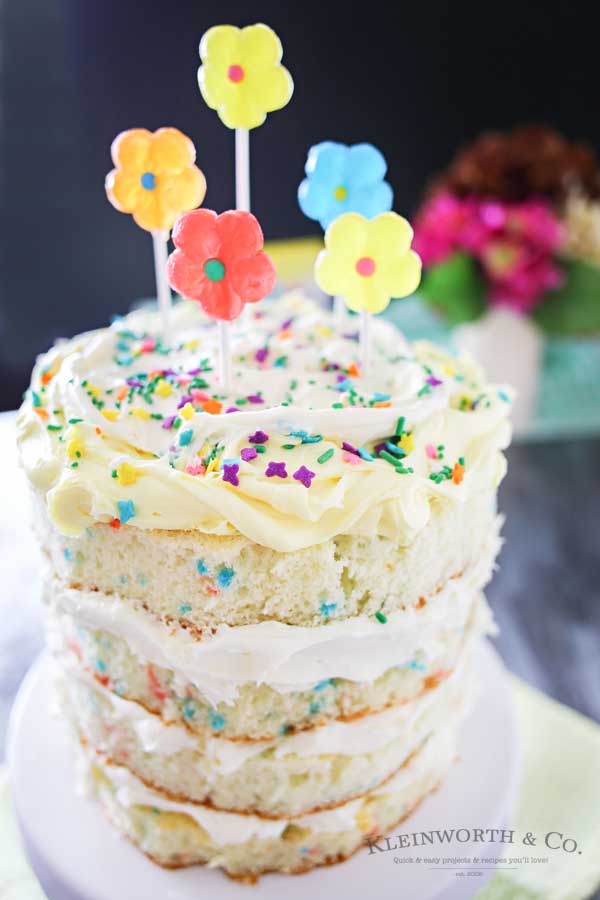 Spring celebrations are fun & easy with this Spring Funfetti® Cake. You can create fun family moments with this cake recipe as one of your Easter desserts. Using frosting just in-between layers for that "naked cake" look that is SO popular right now. It's gives the perfect amount of cake to frosting ratio & it's absolutely delicious! I'm loving it for all our holiday & spring birthday celebrations.