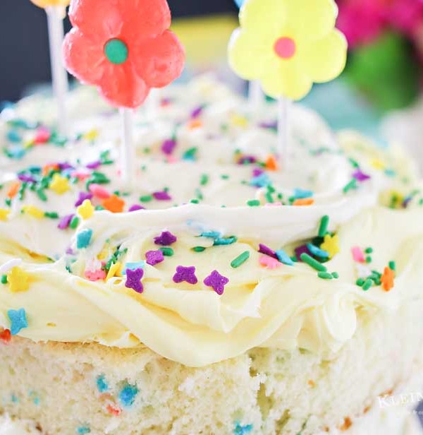 Spring celebrations are fun & easy with this Spring Funfetti Cake. You can create fun family moments with this cake recipe as one of your Easter desserts. Using frosting just in-between layers for that "naked cake" look that is SO popular right now. It's gives the perfect amount of cake to frosting ratio & it's absolutely delicious! I'm loving it for all our holiday & spring birthday celebrations.