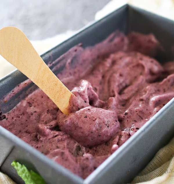 Simple Blueberry Ice Cream is a delicious dairy-free, 3-ingredient recipe with just blueberries, bananas & honey. It takes just a couple minutes & a blender! It's a nutritious dessert that you won't feel guilty about.