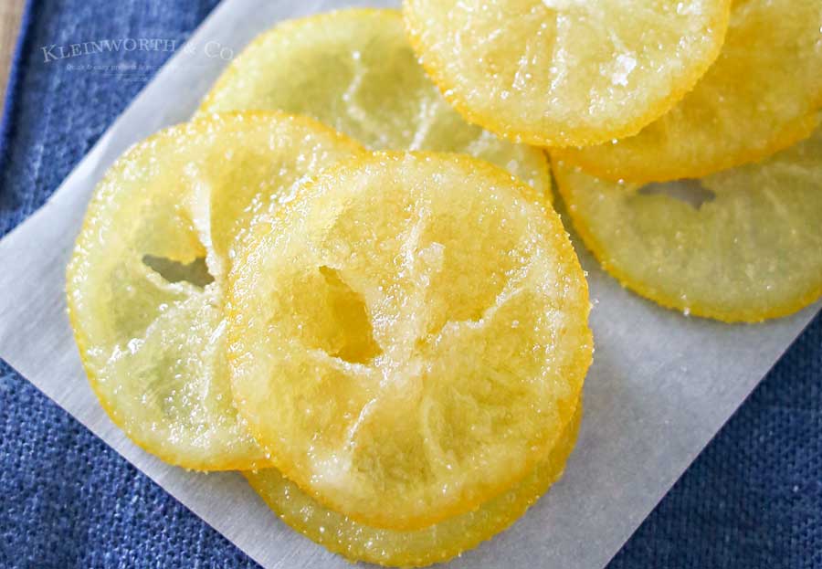 Beautiful Candied Lemon Slices are perfect for topping on pastries, cupcakes, drinks & more spring treats! Easy recipe & a great way to use those lemons. Plus you can use all the leftover lemon simple syrup to add to all your favorite drinks later. Don't miss how I use it as the key ingredient in my most popular recipe here on Kleinworth & Co.