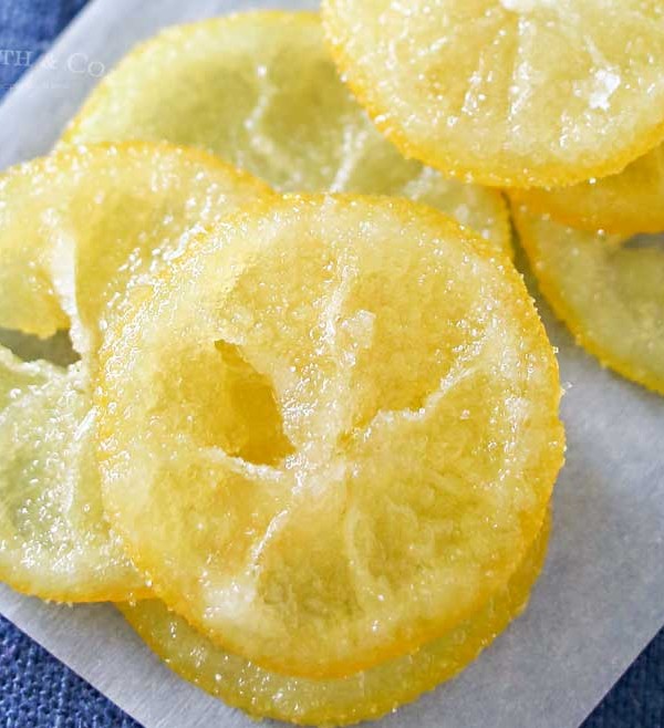 Beautiful Candied Lemon Slices are perfect for topping on pastries, cupcakes, cocktails & more spring treats! Easy recipe & a great way to use those lemons. Plus you can use all the leftover lemon simple syrup to add to all your favorite cocktails later. Don't miss how I use it as the key ingredient in my most popular recipe here on Kleinworth & Co.