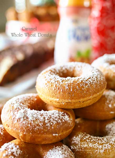 Caramel Whole Wheat Donuts are a lightened up version of the traditional baked cake donut recipe. Using whole wheat flour & just a dusting of confectioners sugar in place of frosting, they are perfect with your morning coffee or at your next brunch. Don't miss my tips for planning a coffee party too.