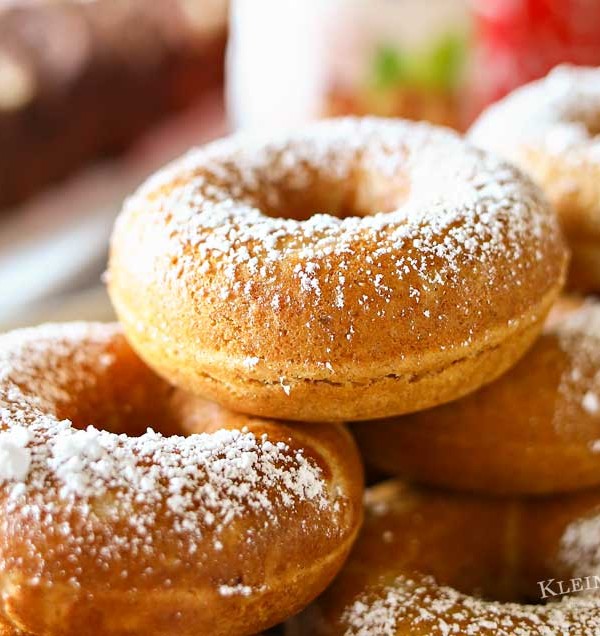 Caramel Whole Wheat Donuts are a lightened up version of the traditional baked cake donut recipe. Using whole wheat flour & just a dusting of confectioners sugar in place of frosting, they are perfect with your morning coffee or at your next brunch. Don't miss my tips for planning a coffee party too.