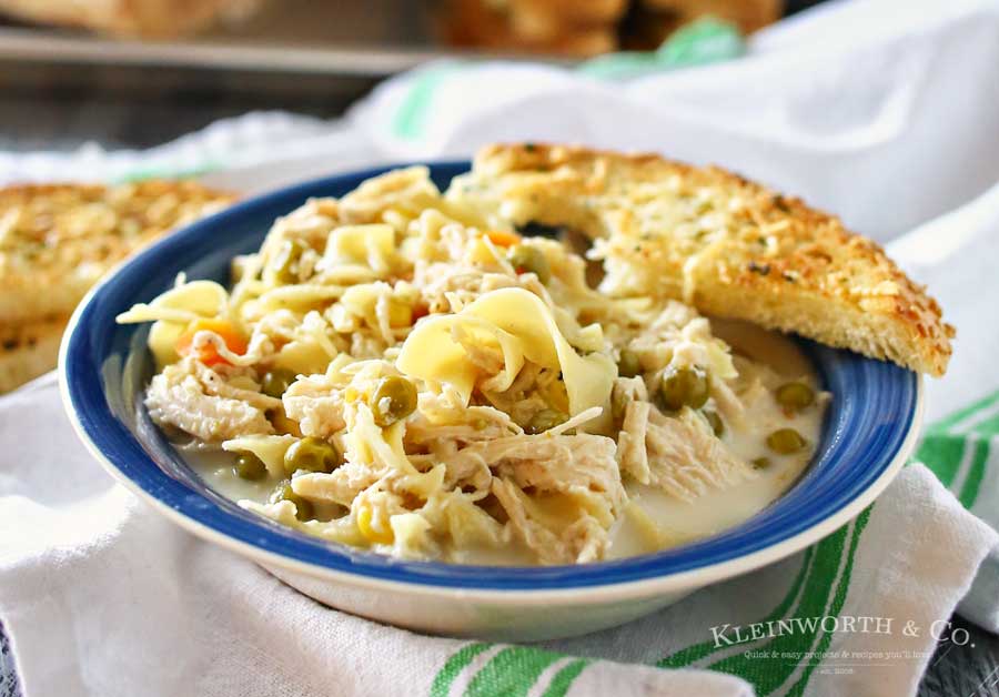 Easy family dinner ideas like this simple crock pot Creamy Chicken Noodle Soup quickly becomes a dinner time favorite. Just toss it all in the slow cooker & dinner is done with little effort. But oh man is it delicious! Absolutely the perfect easy chicken recipe! Don't miss my tips for speeding up the prep process too!