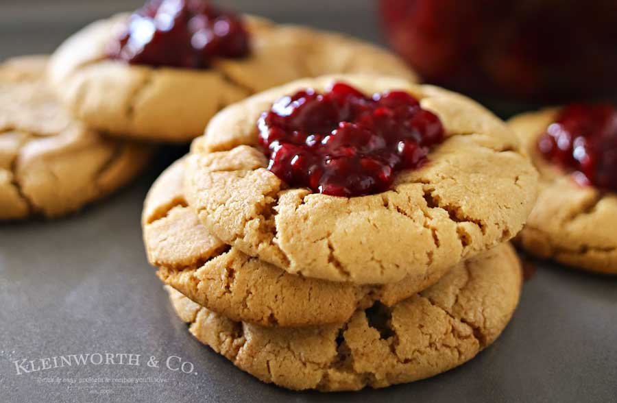 Peanut Butter & Jelly Cookies are a soft & chewy peanut butter cookie recipe topped with a dollop of blackberry preserves. Even better when you make your own jam to add on top. Easy dessert & a PB&J lovers dream! Don't miss my favorite jam recipes I share at the end too. So good!