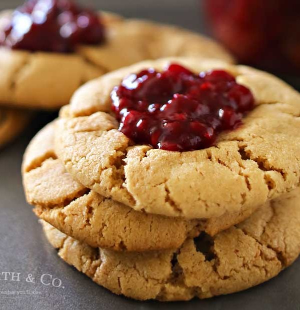 Peanut Butter & Jelly Cookies are a soft & chewy peanut butter cookie recipe topped with a dollop of blackberry preserves. Even better when you make your own jam to add on top. Easy dessert & a PB&J lovers dream! Don't miss my favorite jam recipes I share at the end too. So good!