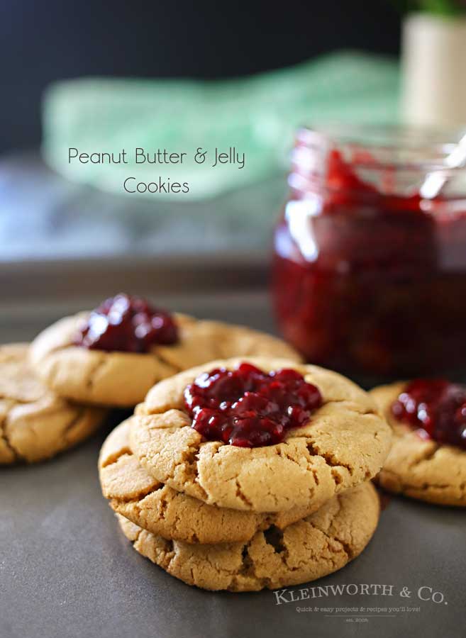 Peanut Butter & Jelly Cookies are a soft & chewy peanut butter cookie recipe topped with a dollop of blackberry preserves. Even better when you make your own jam to add on top. Easy dessert & a PB&J lovers dream! Don't miss my favorite jam recipe I share at the end too. So good!