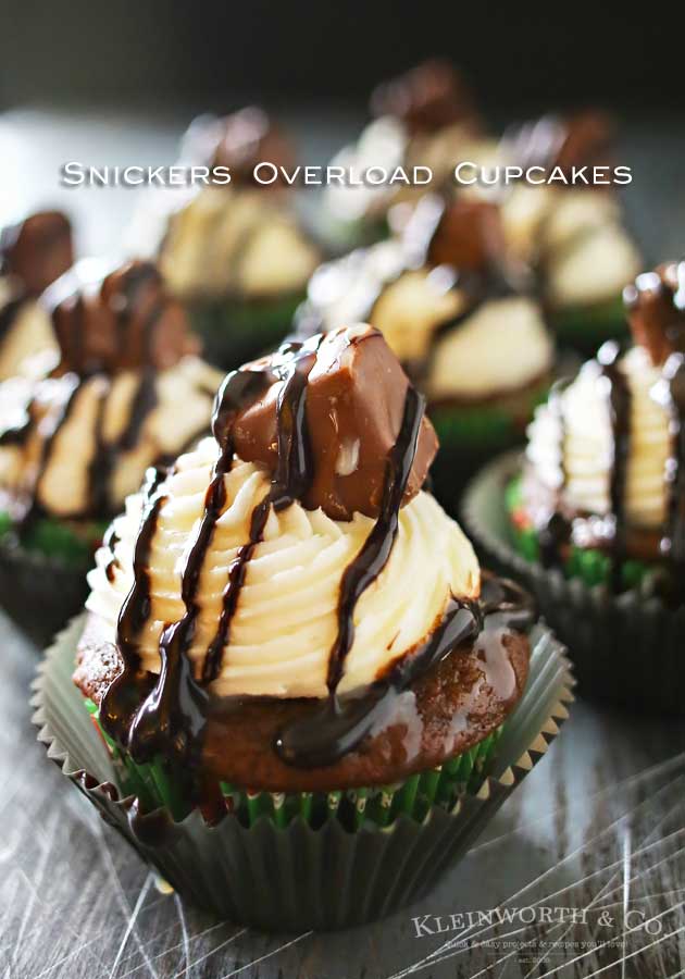 Snickers Overload Cupcakes are simple 3 ingredient chocolate cupcakes stuffed & topped with Snickers bars. Add the easy to make frosting & you are good to go. So good! OMG!!!