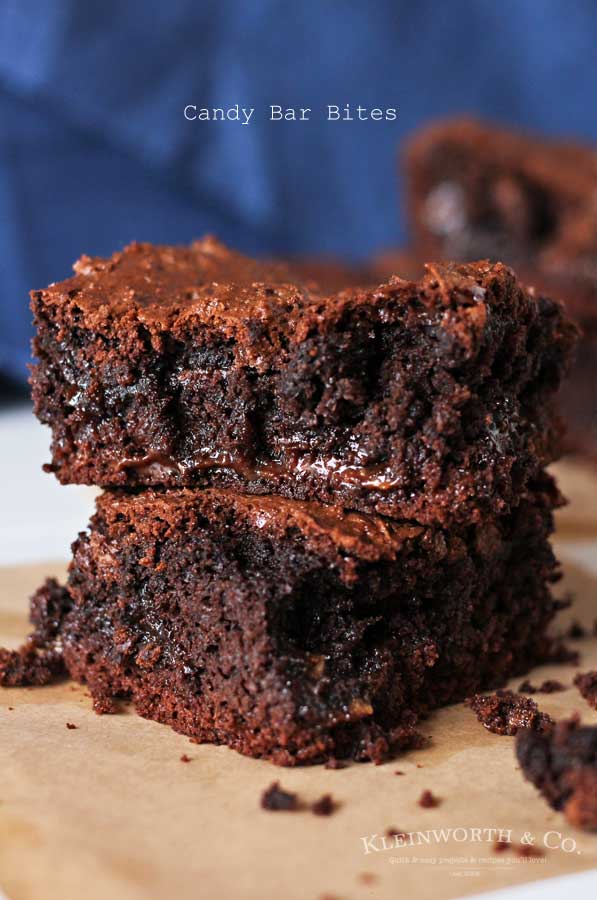 Simple cake mix brownies loaded with candy bars makes Candy Bar Bites that are OUT OF THIS WORLD! If you love yummy bar recipes, these are the perfect treat to satisfy any chocolate craving! Plus they are so easy to make. Just 5 ingredients & less than 1 hour to yummy goodness.