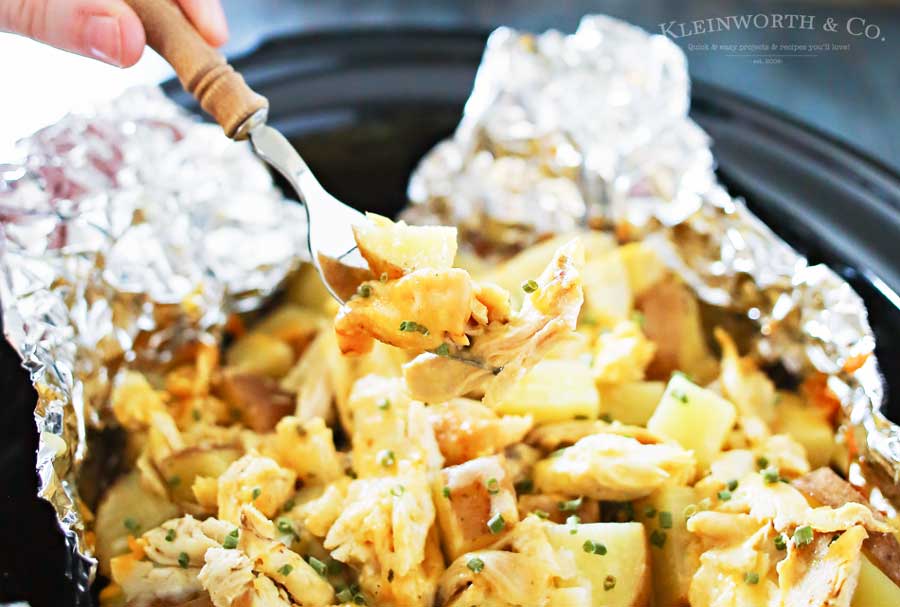 Cheesy Chicken Ranch Potatoes are a simple slow cooker side dish recipe that's so delicious. Just another easy family dinner idea that's ready in just 4 hours. OMG- these are SO GOOD! LOVE that this recipe is family size & uses rotisserie chicken!