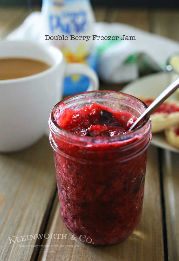 Double Berry Freezer Jam is a simple homemade preserves recipe that takes just about 10 minutes. Perfect for all that summer fruit from the garden! It's great with breakfast or paired with your peanut butter. I even like to add some to my ice cream!