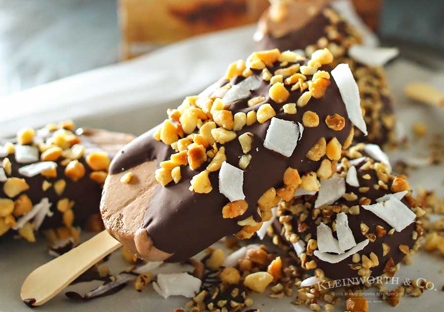 Coconut Nut Ice Cream Bars are the perfect little cool down on a hot summer day. Just a handful of ingredients & a few minutes is all you need. Chocolate ice cream coated with a thick layer of milk chocolate & coated with coconut & macadamia nuts is just heaven.