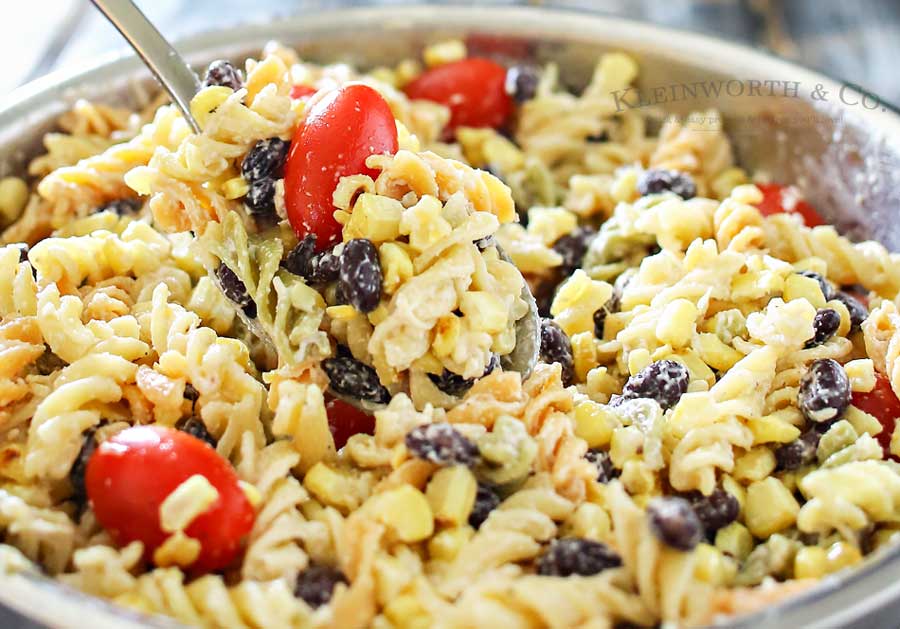 Grilled Corn Pasta Salad is the perfect easy side dish recipe to bring to all your holiday celebrations & backyard BBQ's. Delicious pasta salad for a crowd.