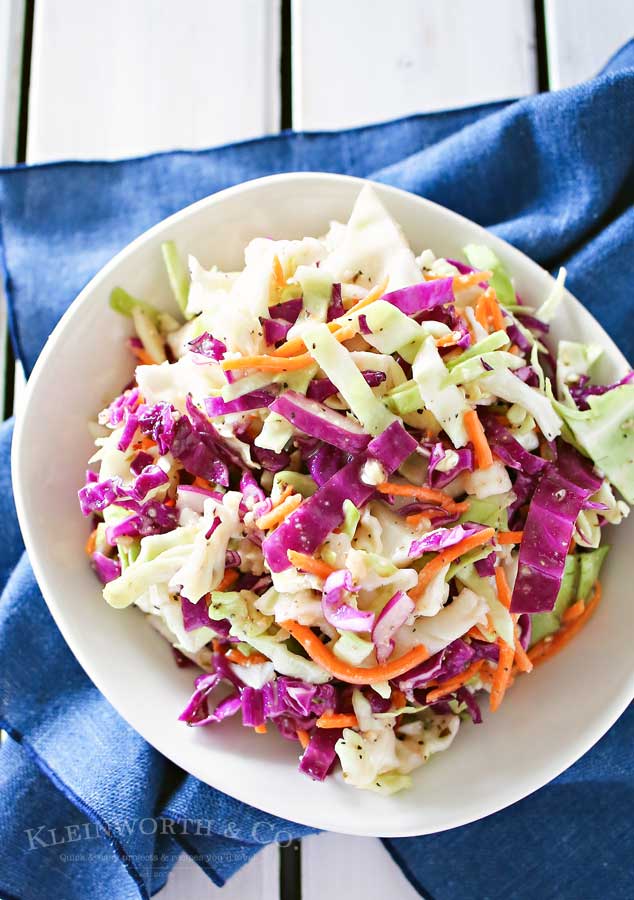 Italian Coleslaw is a twist on the classic backyard bbq side dish. Zesty & flavorful, this coleslaw recipe is sure to be a favorite all summer long.