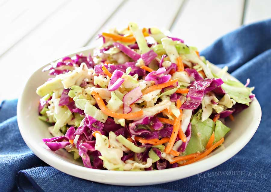 Italian Coleslaw is a twist on the classic backyard bbq side dish. Zesty & flavorful, this coleslaw recipe is sure to be a favorite all summer long.
