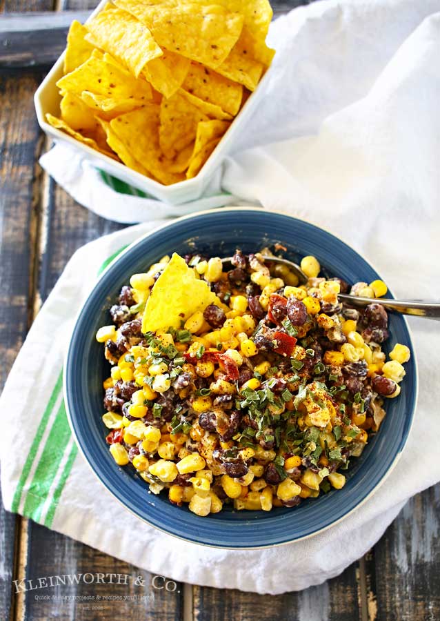 Mexican Corn Salsa is a zesty blend of corn, black beans, peppers, chiles & onions sauteed in butter & spices & mixed with a kicky lime crema. Scrumptious! It's so good by itself or mixed in other dishes.