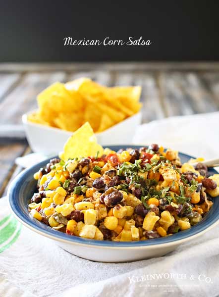 Mexican Corn Salsa is a zesty blend of corn, black beans, peppers, chiles & onions sauteed in butter & spices & mixed with a kicky lime crema. Scrumptious! It's so good by itself or mixed in other dishes.