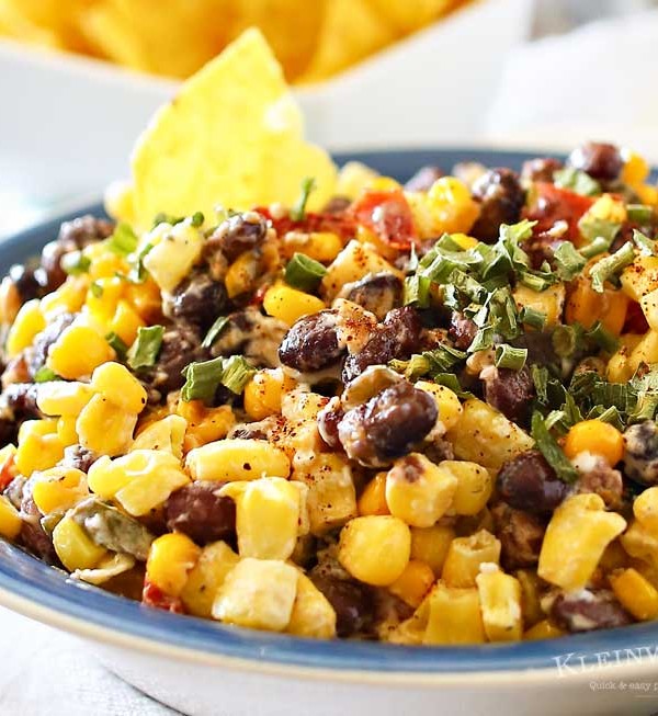 Mexican Corn Salsa is a zesty blend of corn, black beans, peppers, chiles & onions sauteed in butter & spices & mixed with a kicky lime crema. Scrumptious! It's so good by itself or mixed in other dishes.