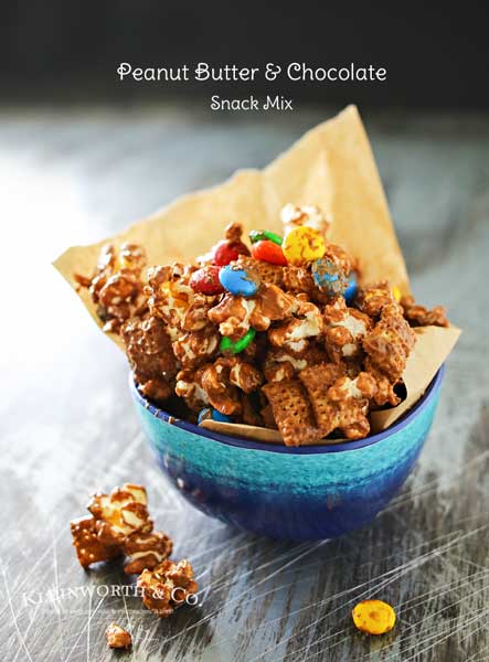 Peanut Butter Chocolate Snack Mix is made with popcorn, Chex cereal, M&M's & peanut butter & chocolate chips making one of our favorite chex mix recipes. It's seriously one of those recipes I can't stop eating. Peanut butter & chocolate are always a favorite.