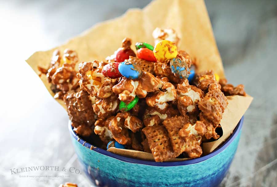 Peanut Butter Chocolate Snack Mix is made with popcorn, Chex cereal, M&M's & peanut butter & chocolate chips making one of our favorite chex mix recipes. It's seriously one of those recipes I can't stop eating. Peanut butter & chocolate are always a favorite.