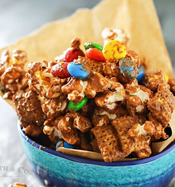 Peanut Butter Chocolate Snack Mix is made with popcorn, Chex cereal, M&M's & peanut butter & chocolate chips making one of our favorite chex mix recipes. It's seriously one of those recipes I can't stop eating. Peanut butter & chocolate are always a favorite.