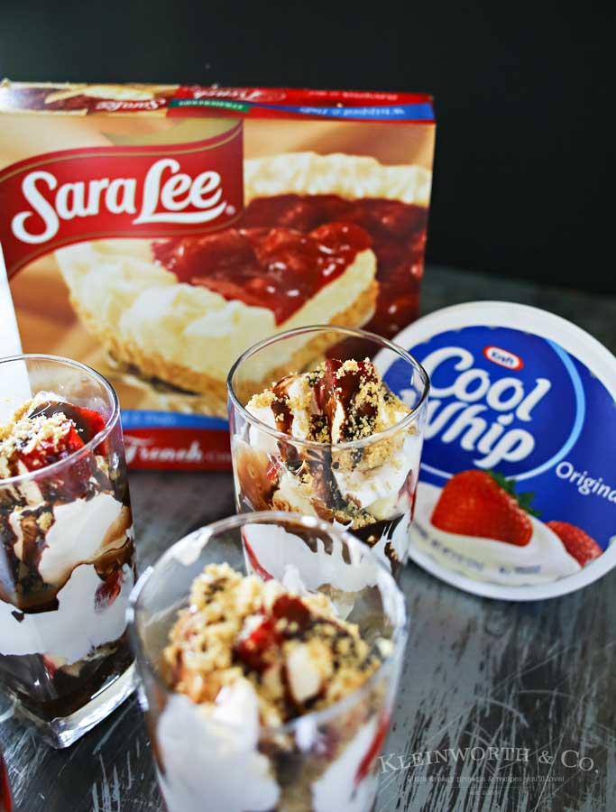 Strawberry Cheesecake Parfait is made with chunks of strawberry topped cheesecake, whipped topping, chocolate syrup & graham cracker sprinkles. A perfect easy treat to serve for Mother's Day.