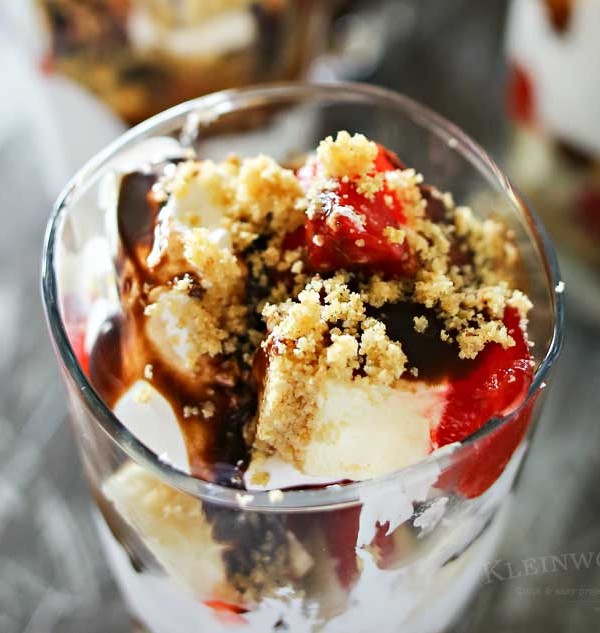 Strawberry Cheesecake Parfait is made with chunks of strawberry topped cheesecake, whipped topping, chocolate syrup & graham cracker sprinkles. A perfect easy treat to serve for Mother's Day.