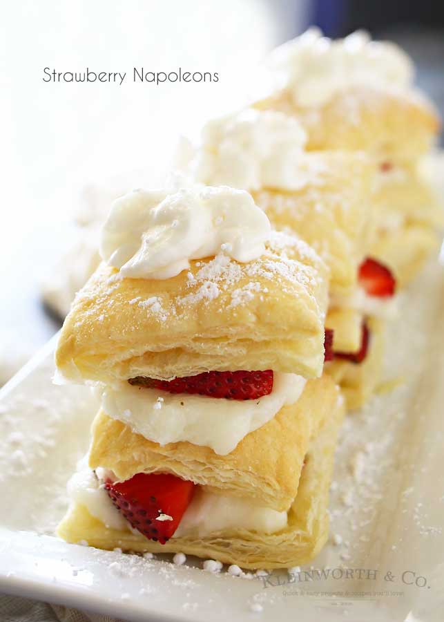 Strawberry Napoleons are an easy dessert recipe made with puff pastry, pudding, strawberries & dusted with confectioners sugar. The perfect summer dessert for any occasion.