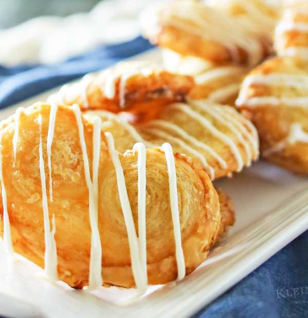 White Chocolate Palmiers are a simple cookie made with puff pastry. Ready in as little as 30 minutes, they make a great addition to summer brunch.