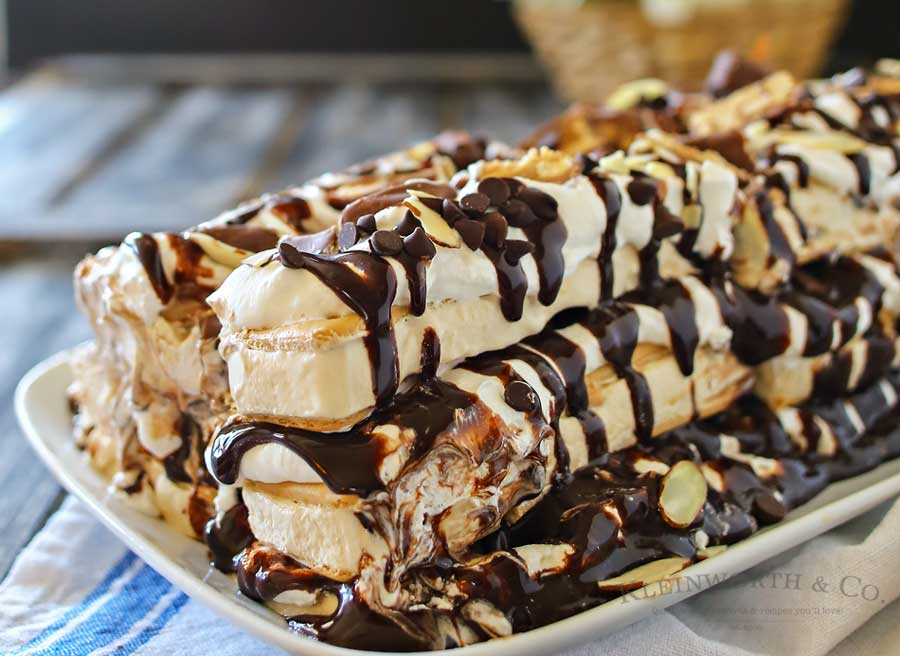 Snickers Ice Cream Cake is made with salted caramel ice cream bars, whipped cream & loaded with Snickers candy bars. It's over the top amazing!