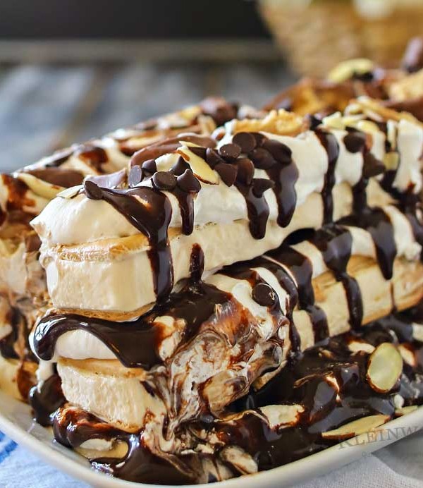 Snickers Ice Cream Cake is made with salted caramel ice cream bars, whipped cream & loaded with Snickers candy bars. It's over the top amazing!