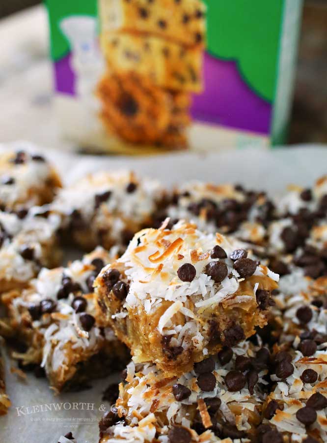 Caramel Coconut Blondies, a yummy bar recipe loaded with butterscotch & chocolate & topped with a layer of caramel, toasted coconut & more chocolate chips.