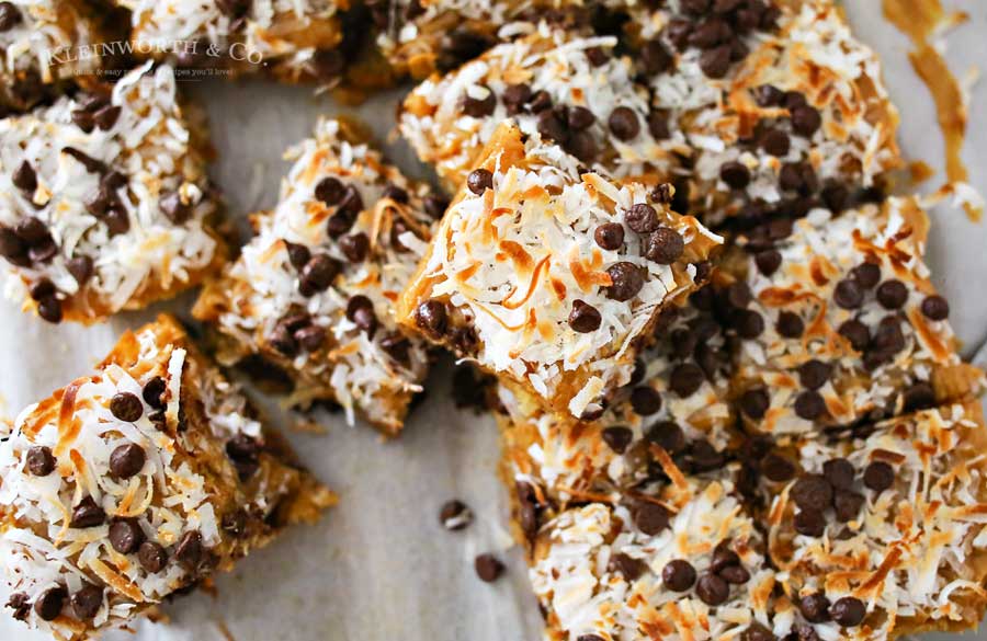 Caramel Coconut Blondies, a yummy bar recipe loaded with butterscotch & chocolate & topped with a layer of caramel, toasted coconut & more chocolate chips.