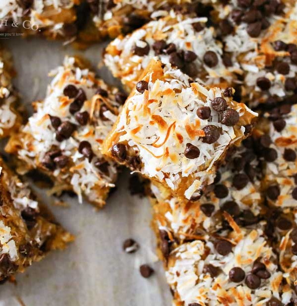 Caramel Coconut Blondies, a yummy bar recipe loaded with butterscotch & chocolate & topped with a layer of caramel, toasted coconut & more chocolate chips.