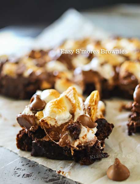 Easy S'mores Brownies are the perfect summer treat. Fudgy brownies topped with graham crackers, milk chocolate & marshmallows makes a yummy, toasty dessert.