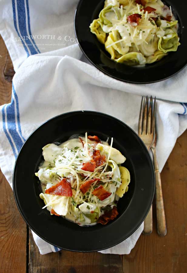 Bacon Alfredo Tortellini is an easy family dinner idea for bacon lovers everywhere. Homemade alfredo sauce, cheesy spinach tortellini & crispy bacon is good